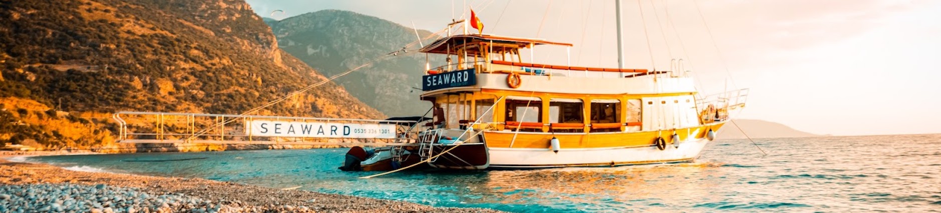 Boat docked on rocky beach